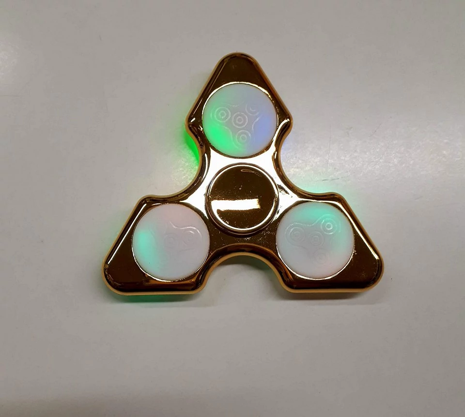 Fidget Spinner világítós pörgettyű - arany